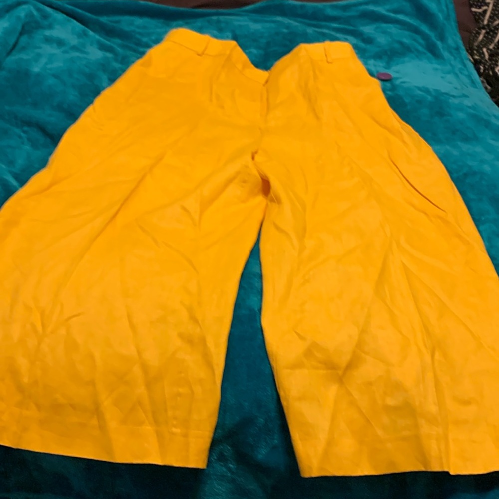 These are yellow gold linen wide leg pants with tags.
